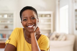 Woman with dental bridge in Shorewood smiling at home