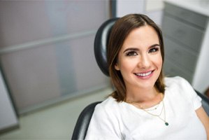 Woman with dental bridge in Shorewood smiling