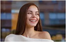 Woman with flawless smile after cosmetic dentistry