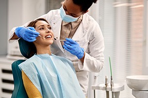 A woman preparing to receive a dental checkup