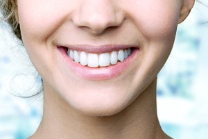 Closeup of woman smiling with dental crown in Shorewood
