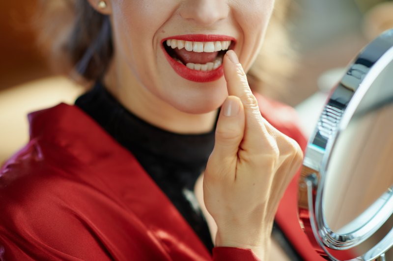 Patient smiling with dental implants